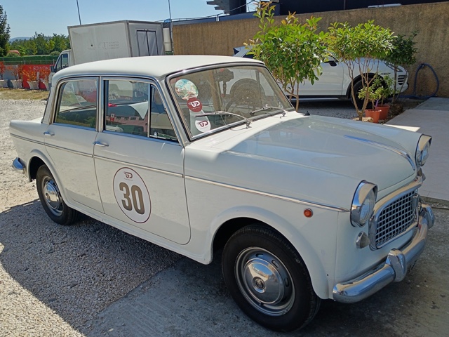 www.targhenere.net/gallery2/wp-content/uploads/2026/07/fiat_1100_d_lug26_front_blowup_tn41656.jpg